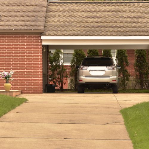 Customers home with a car parked in a carport